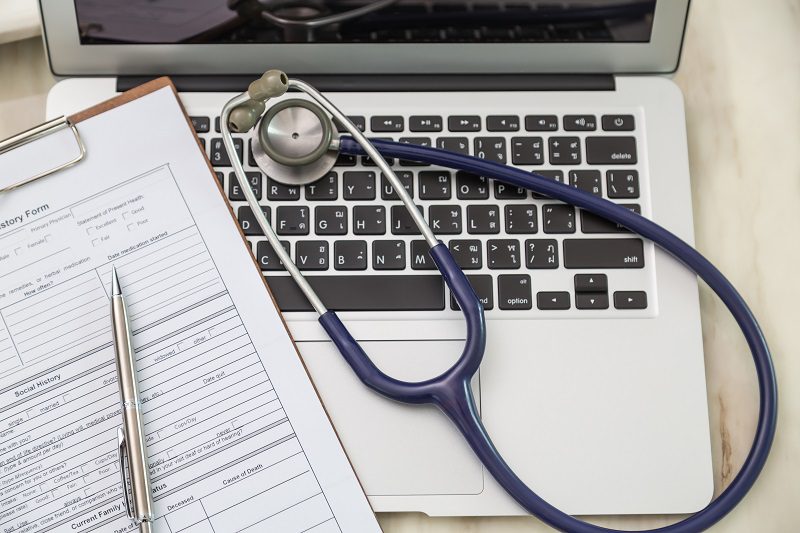 Stethoscope on computer used for comprehensive diagnosis and cost-effective telehealth at our functional medicine clinic, specializing in autoimmune disorders, hormone balancing, weight loss, cancer care, and mental health counseling.